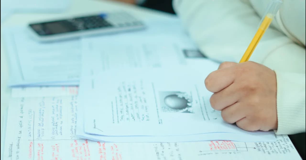 A GCSE maths worksheet and calculator at Excel Tutors