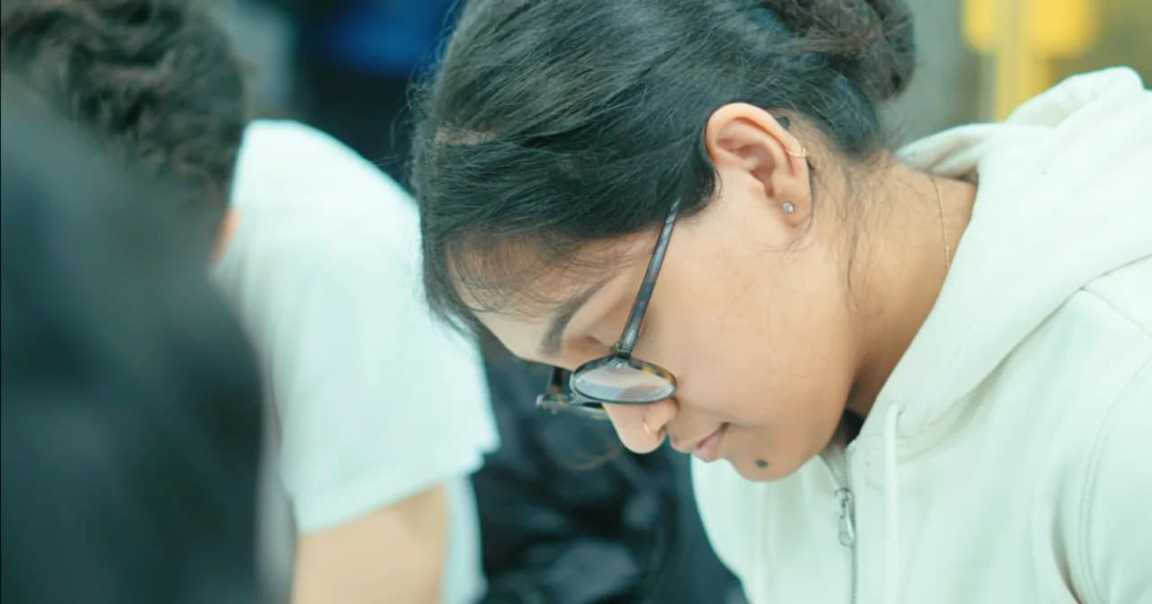 A student tackling a long-form STEP maths problem at Excel Tutors