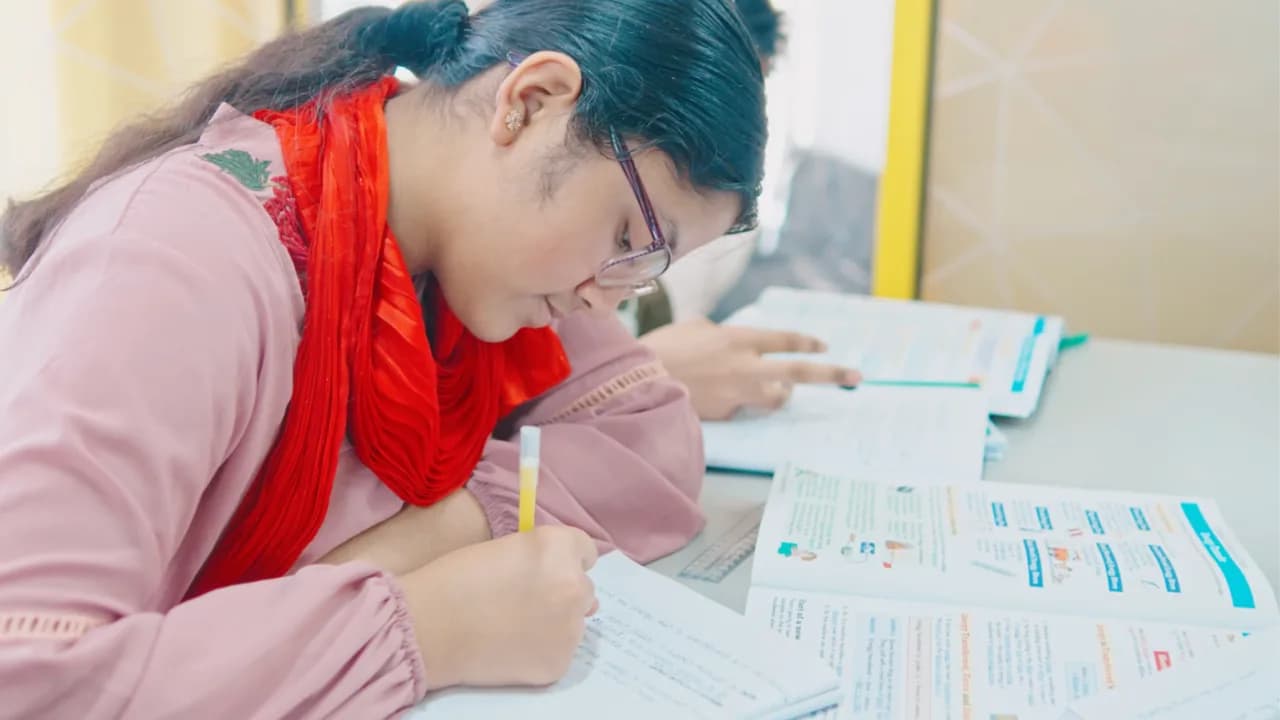 A pupil working through a GL-style 11+ practice paper at Excel Tutors