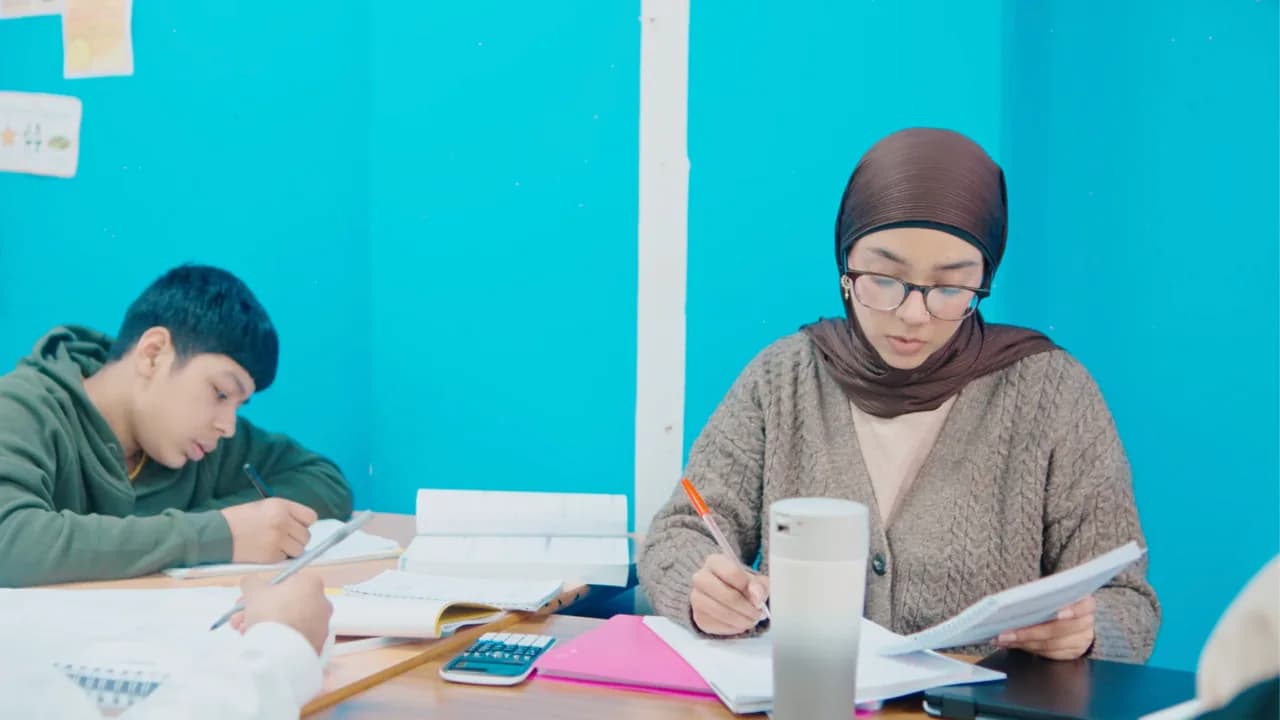 A primary pupil reading at Excel Tutors